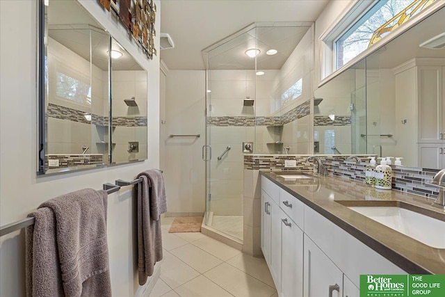full bathroom with a sink, decorative backsplash, and a stall shower