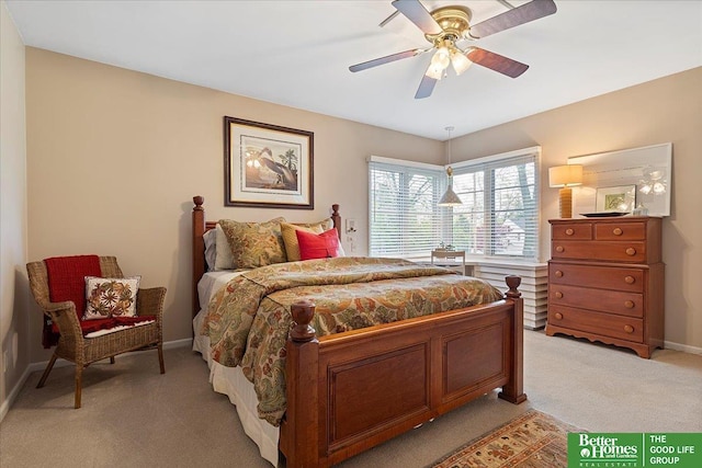 bedroom featuring baseboards, light carpet, and a ceiling fan
