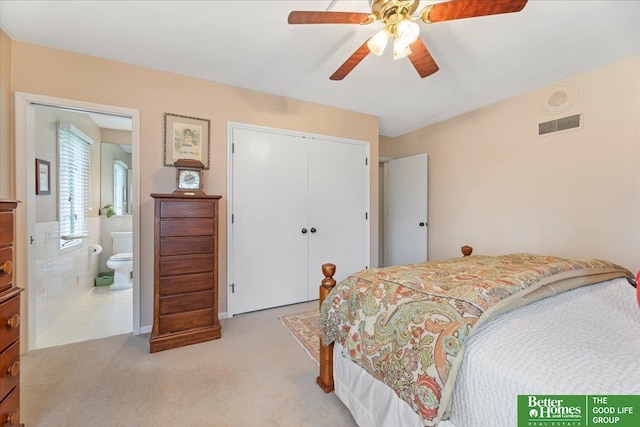 bedroom with connected bathroom, light colored carpet, a ceiling fan, visible vents, and a closet