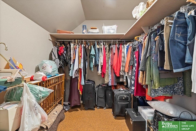 spacious closet featuring carpet and lofted ceiling