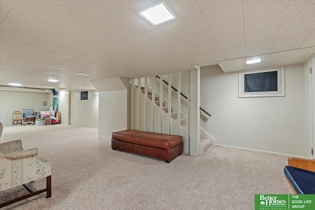 finished basement with carpet flooring and stairs