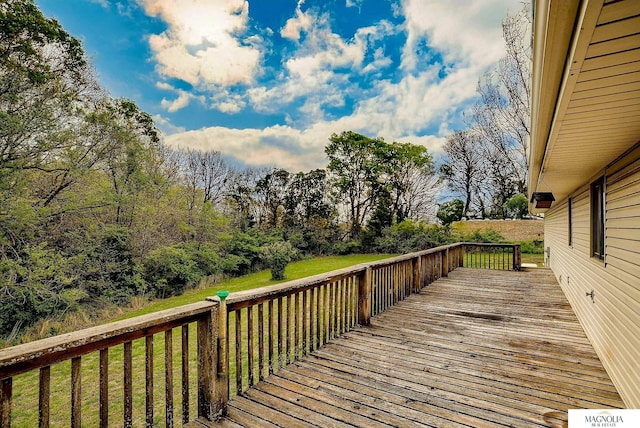 deck featuring a lawn