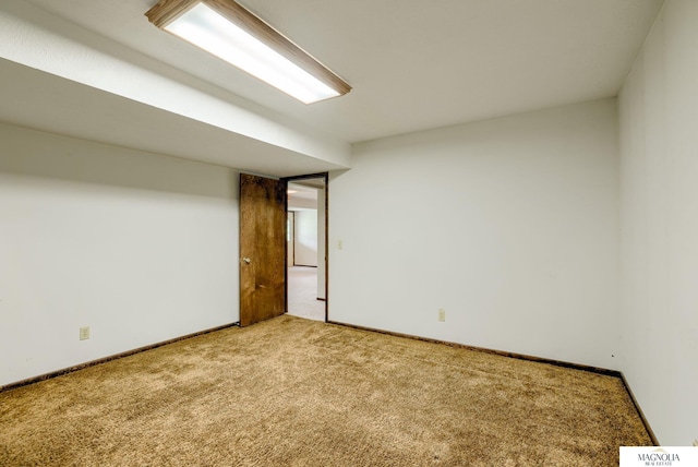 carpeted empty room with baseboards