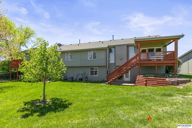 rear view of property with a wooden deck, stairs, a yard, and cooling unit