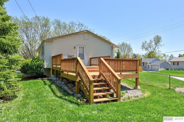 back of property with fence, stairs, a yard, and a deck