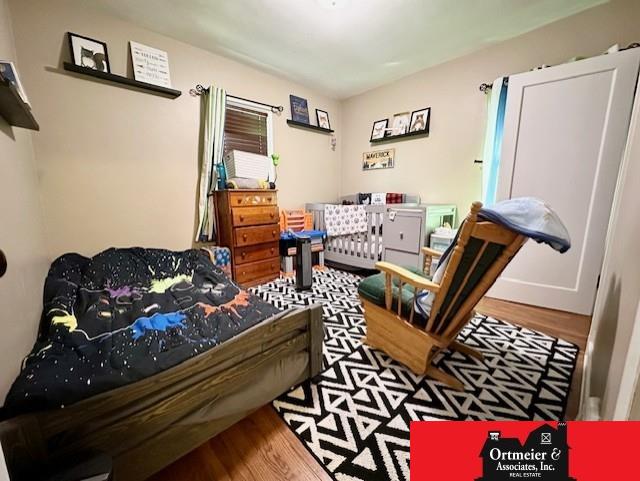 bedroom featuring wood finished floors