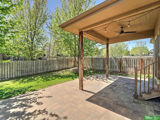 view of patio with a ceiling fan and a fenced backyard