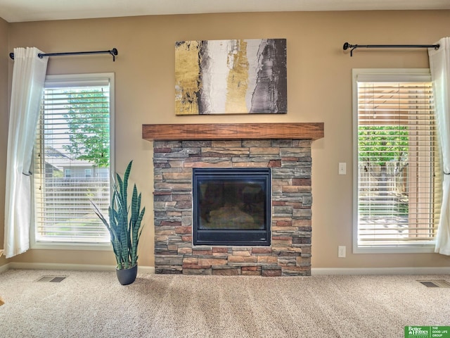 living room featuring carpet floors, baseboards, and visible vents