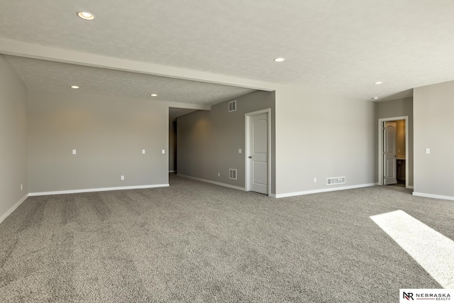 spare room featuring visible vents, recessed lighting, baseboards, and carpet