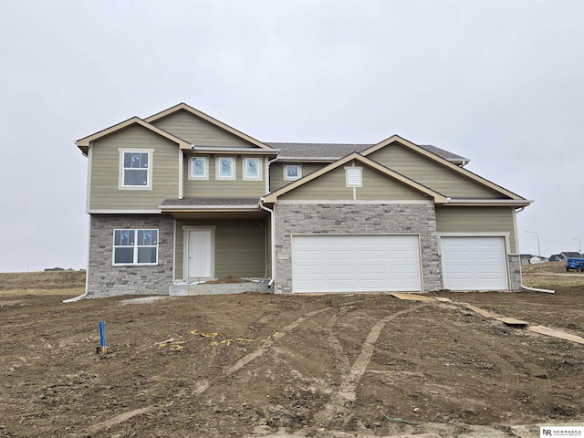 11057 N 173rd St, Bennington, NE 68007 - craftsman-style house with a garage, dirt driveway, and stone siding