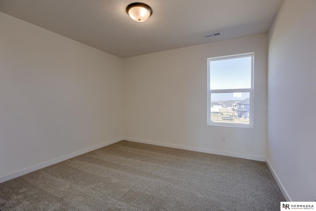 11057 N 173rd St, Bennington, NE 68007 - unfurnished room featuring visible vents, carpet, and baseboards