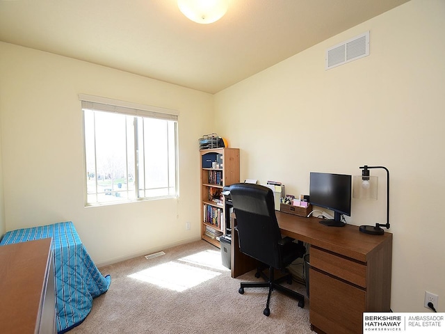 office area featuring baseboards, carpet, and visible vents