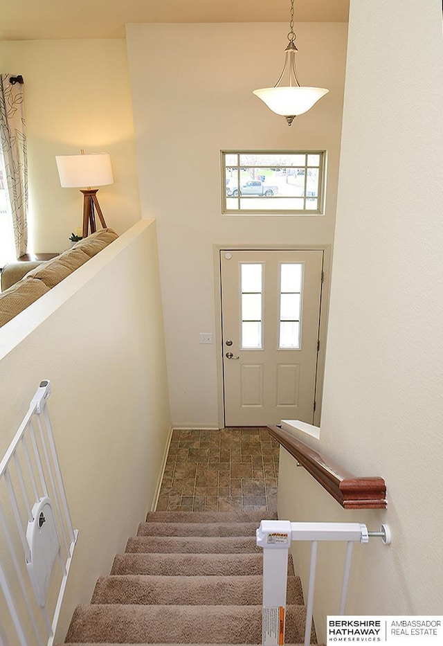 stairs featuring baseboards