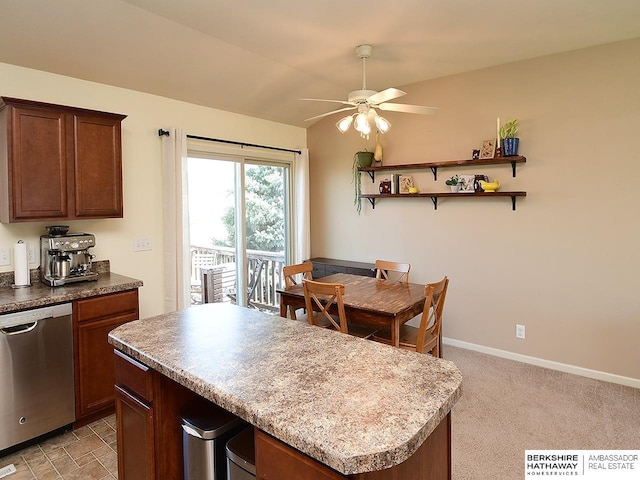 kitchen featuring stainless steel dishwasher, open shelves, a kitchen island, baseboards, and ceiling fan
