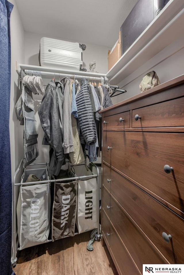 spacious closet with wood finished floors