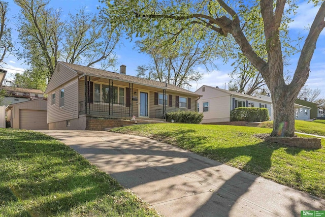 ranch-style home with driveway, a chimney, a detached garage, an outdoor structure, and a front lawn