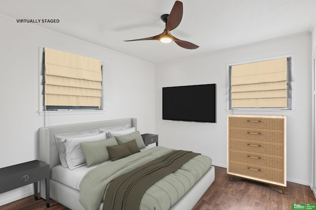 bedroom featuring crown molding, a ceiling fan, and wood finished floors