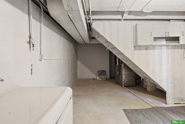 below grade area featuring concrete block wall