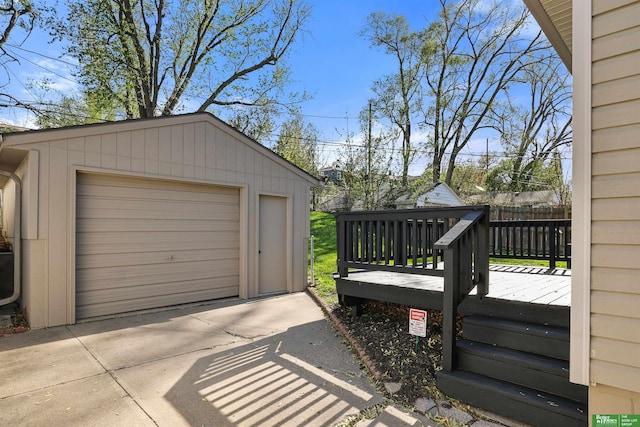 detached garage with concrete driveway
