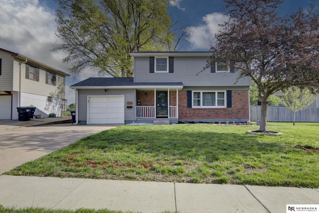traditional-style house with a front yard, a garage, brick siding, fence, and concrete driveway