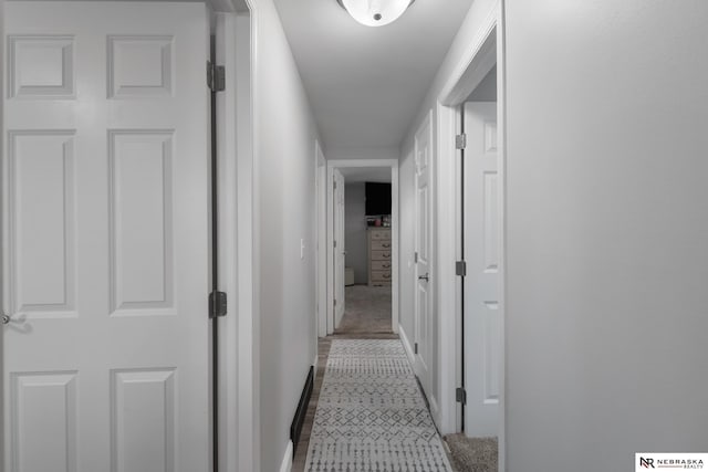 corridor featuring baseboards