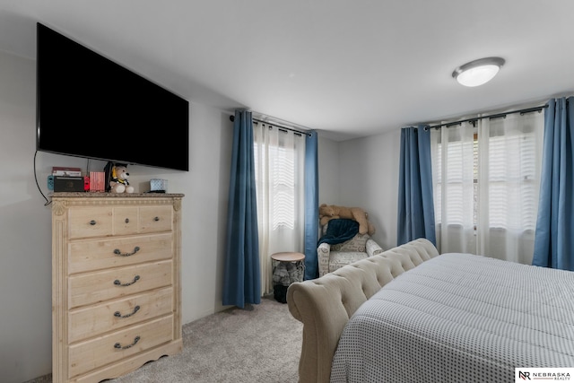 bedroom featuring light carpet