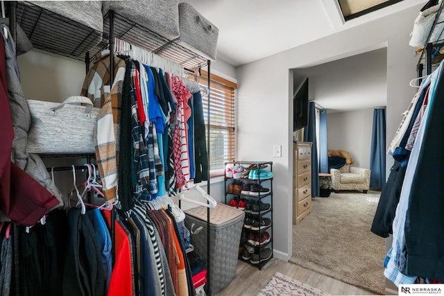 spacious closet with wood finished floors