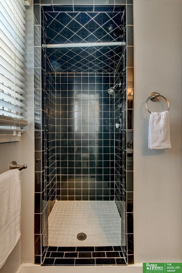 bathroom with a stall shower
