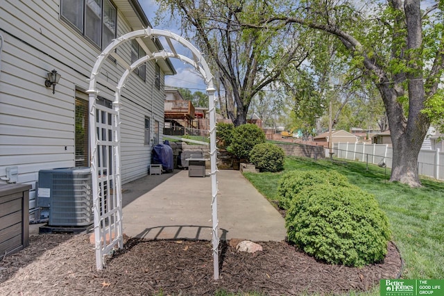 view of yard featuring a patio, fence, and cooling unit