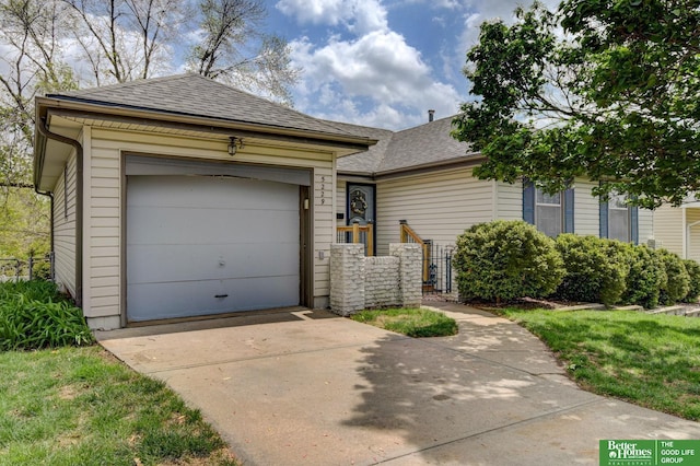 ranch-style home with fence, driveway, and a shingled roof