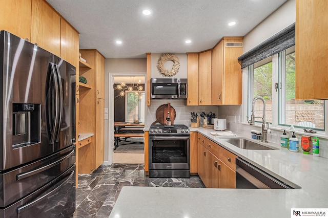 kitchen with visible vents, marble finish floor, tasteful backsplash, a sink, and appliances with stainless steel finishes