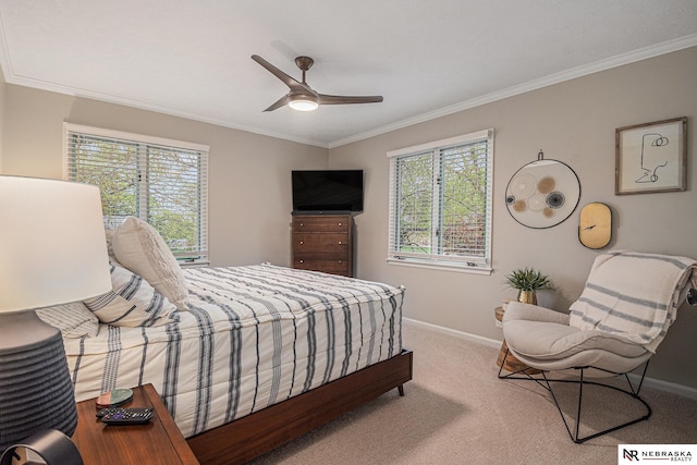 carpeted bedroom with baseboards, crown molding, and multiple windows