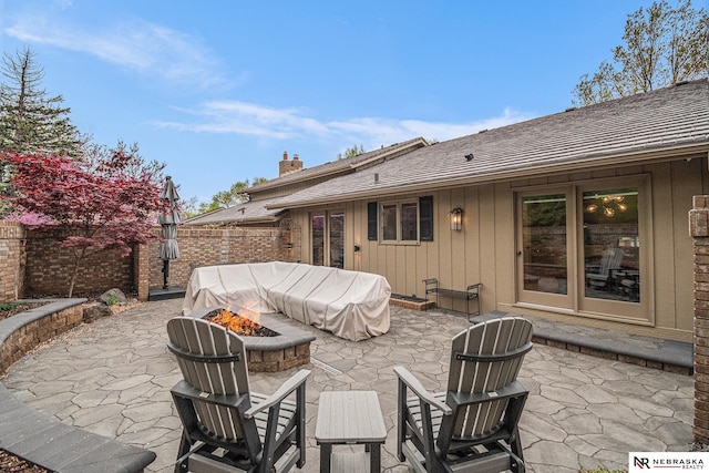 view of patio with a fenced backyard and an outdoor fire pit