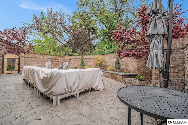 view of patio / terrace featuring outdoor dining area and a fenced backyard
