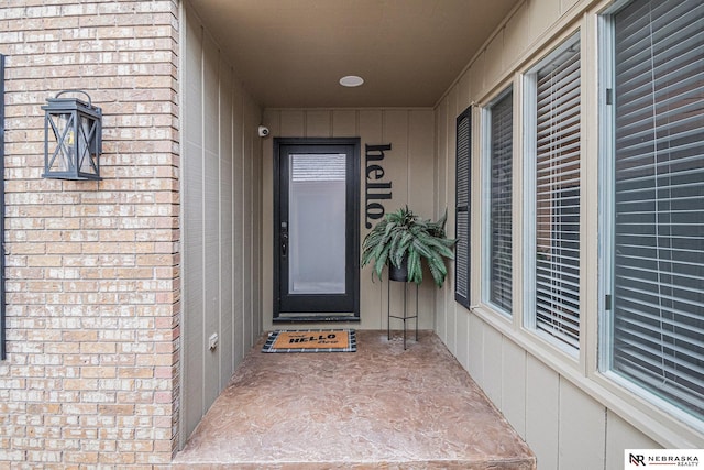 property entrance with brick siding