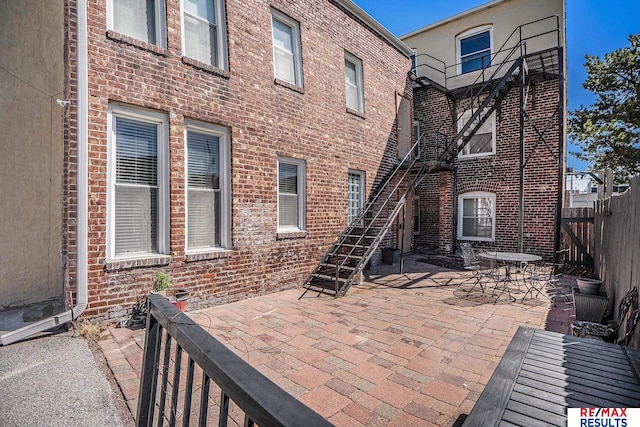exterior space featuring fence and stairway