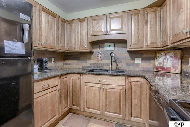 kitchen featuring a sink, tasteful backsplash, black appliances, and dark stone countertops