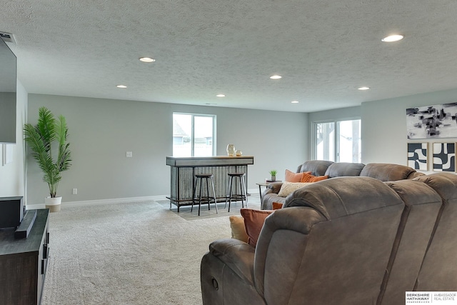 living room with carpet, recessed lighting, and a wealth of natural light