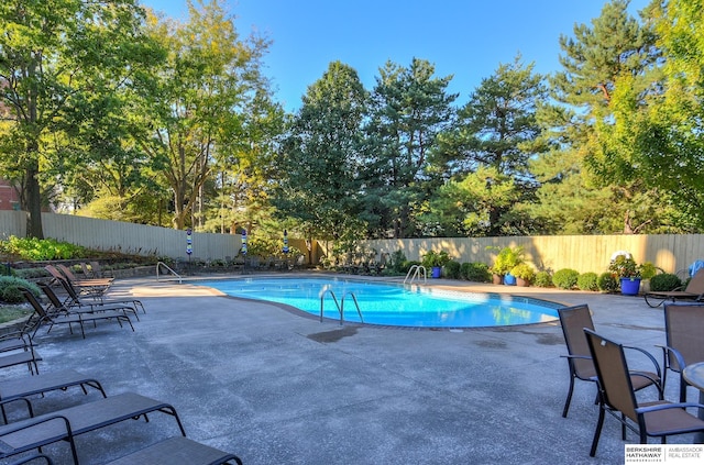 view of pool with fence, a fenced in pool, and a patio area