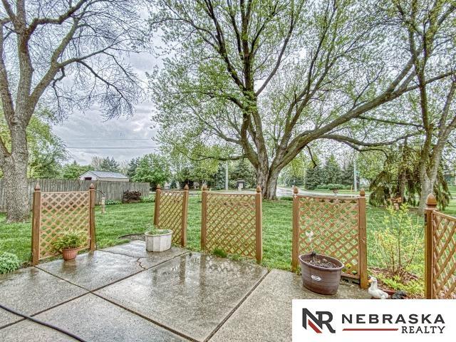 view of patio featuring fence