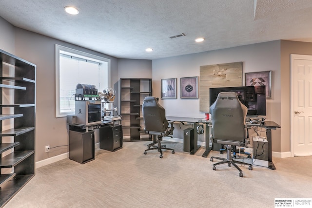 carpeted office with recessed lighting, baseboards, visible vents, and a textured ceiling