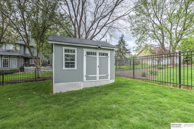 view of shed with a fenced backyard