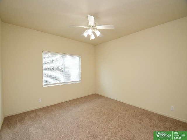 carpeted empty room with baseboards and ceiling fan
