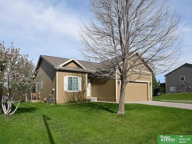 view of front of home with concrete driveway, a front yard, and a garage