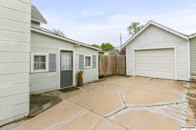 exterior space with fence and concrete driveway