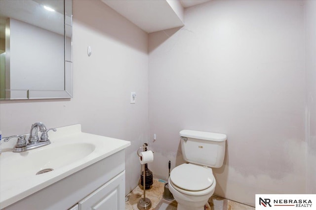 half bath with toilet and vanity