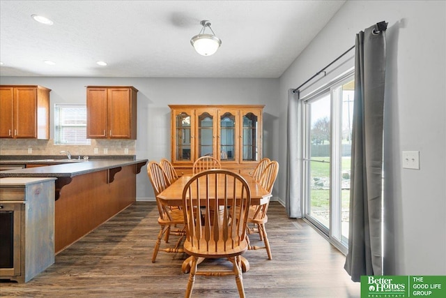 7714 S 167th St, Omaha, NE 68136 - dining space featuring dark wood-style flooring, recessed lighting, and a wealth of natural light