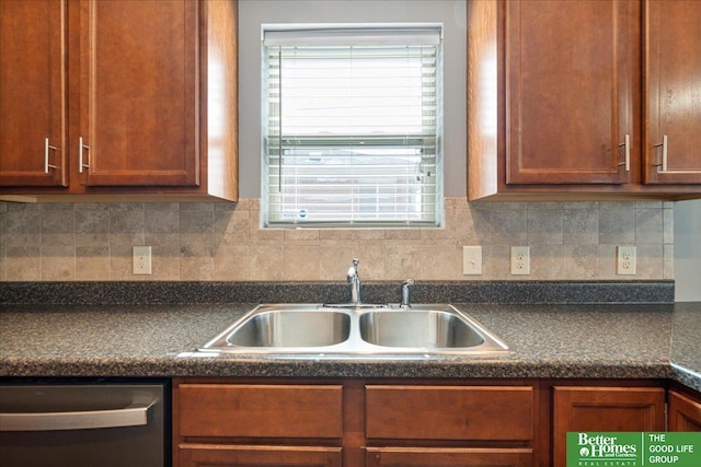 7714 S 167th St, Omaha, NE 68136 - kitchen with stainless steel dishwasher, dark countertops, a wealth of natural light, and a sink