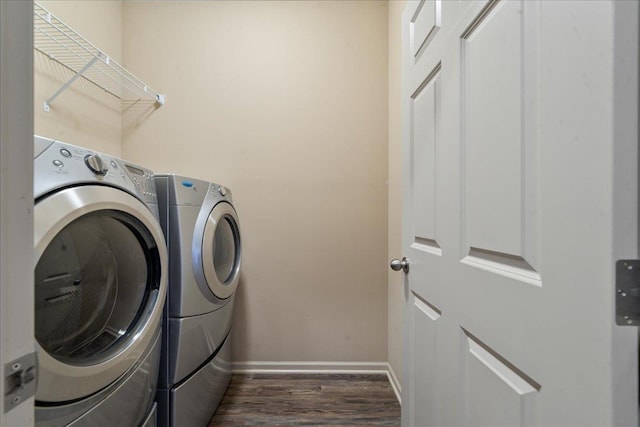 7714 S 167th St, Omaha, NE 68136 - laundry room with laundry area, washer and clothes dryer, dark wood-style flooring, and baseboards