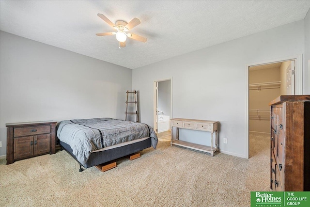 7714 S 167th St, Omaha, NE 68136 - carpeted bedroom with ceiling fan, baseboards, a closet, a spacious closet, and ensuite bath